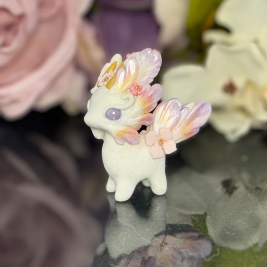 Tiny Purple, Orange gold and Pink wingless Bunnigon