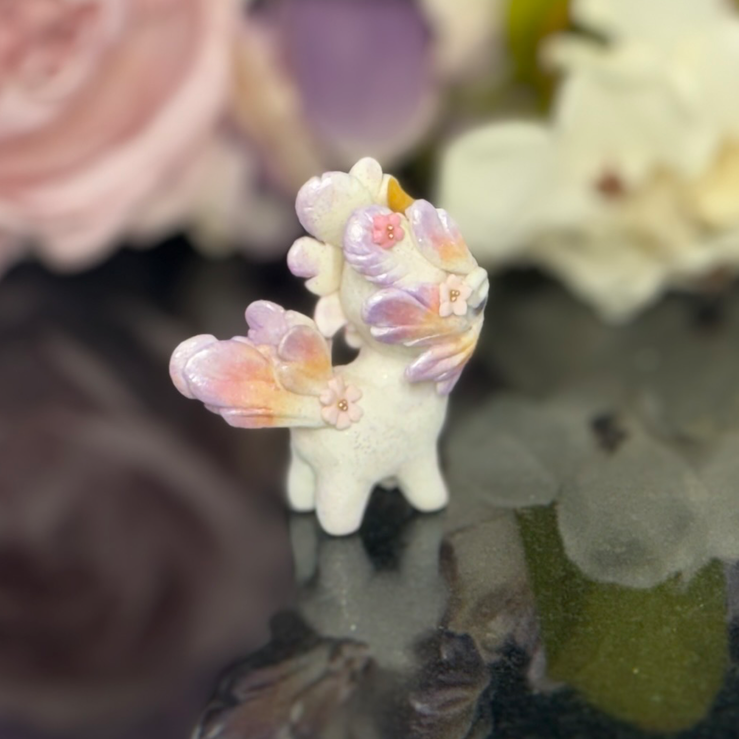 Tiny Purple, Orange gold and Pink wingless Bunnigon