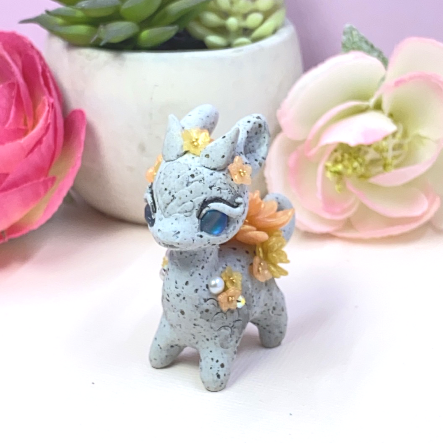 Stone Dragon with Peach and Yellow Succulents