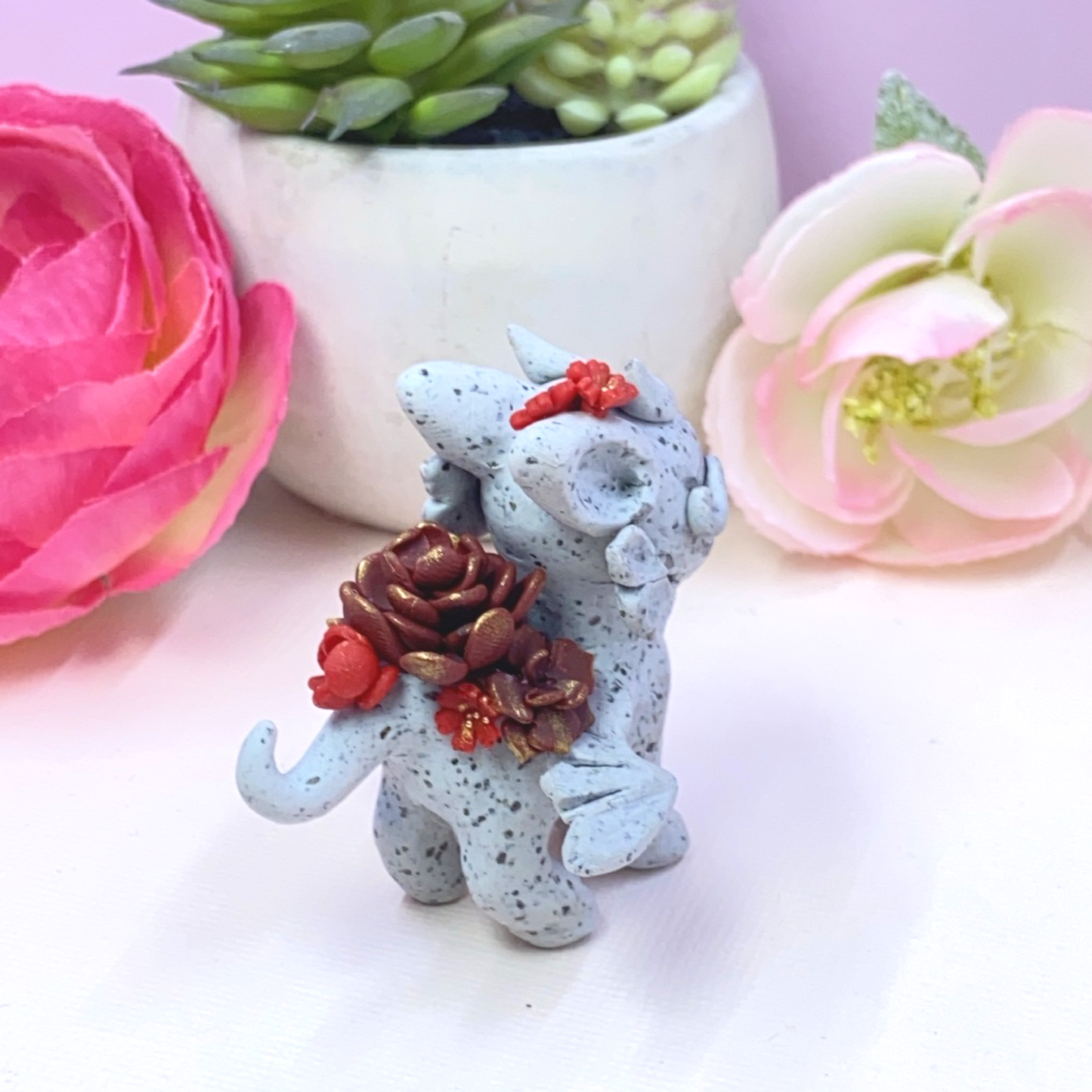 Stone Dragon with Red Succulents