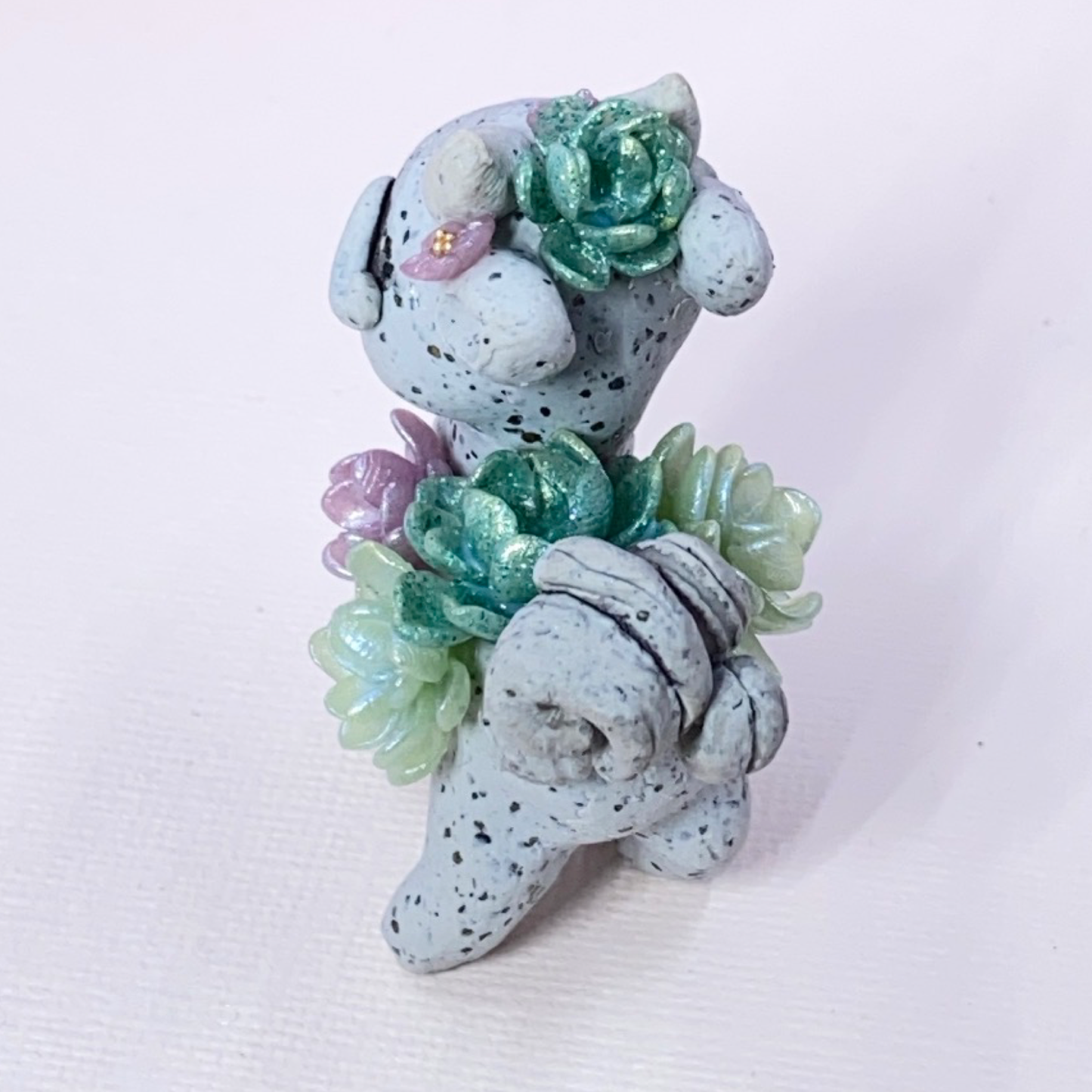 Stone Dragon with Purple and Green Succulents