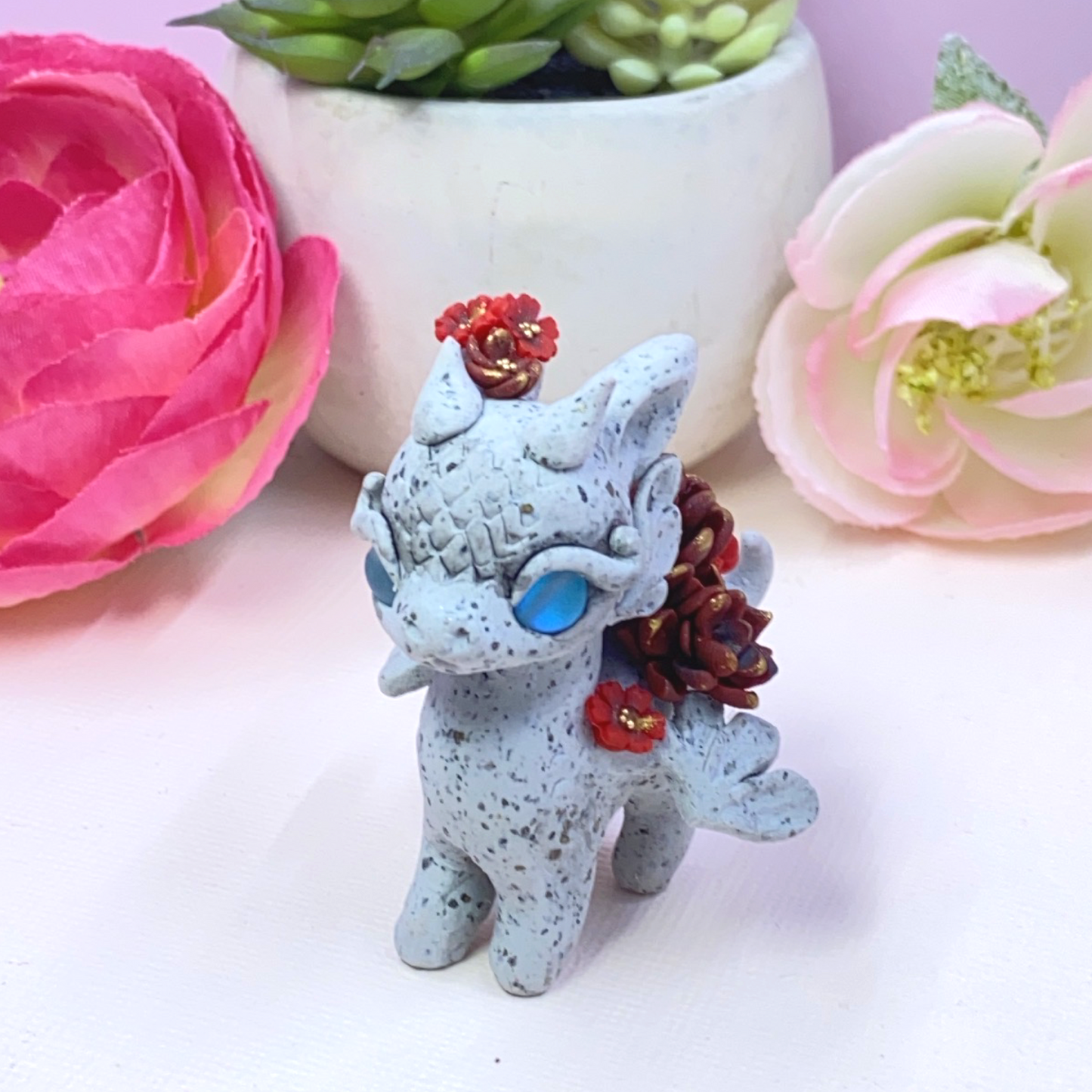 Stone Dragon with Red Succulents