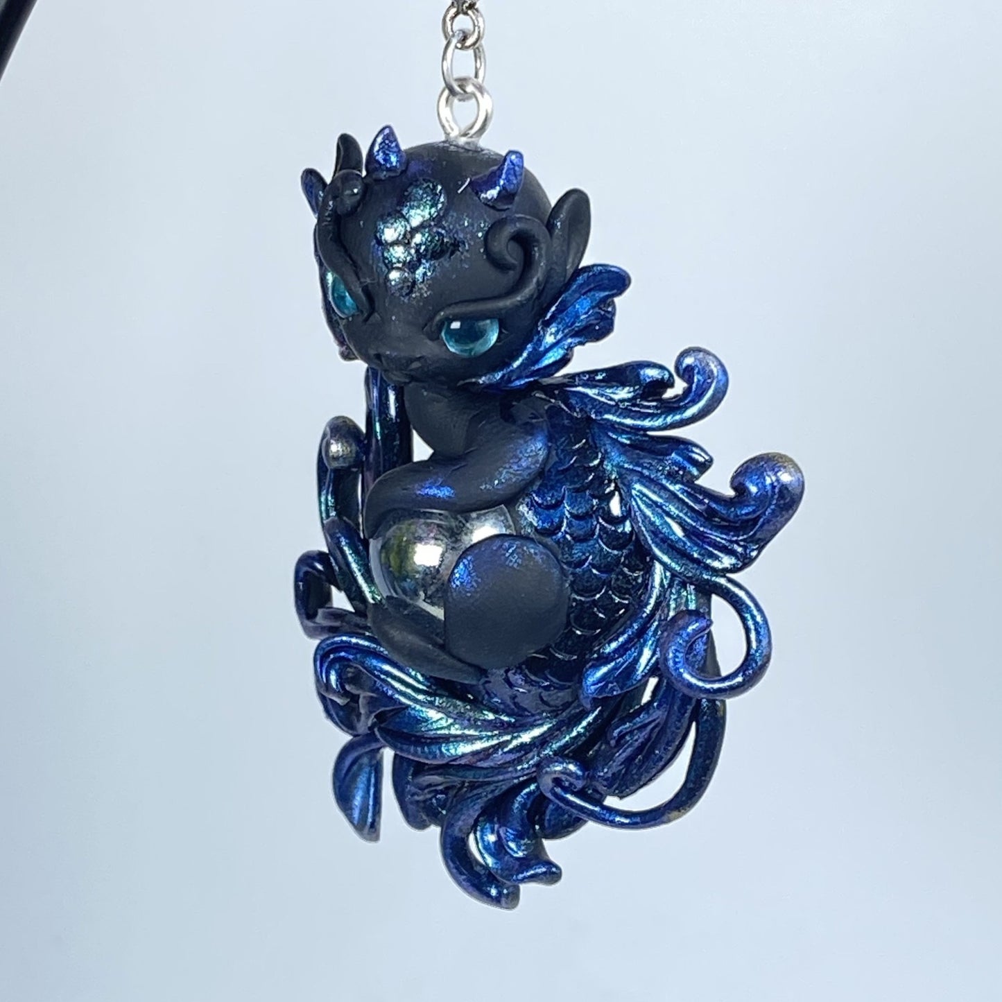 Fancy tailed blue and Black Dragon