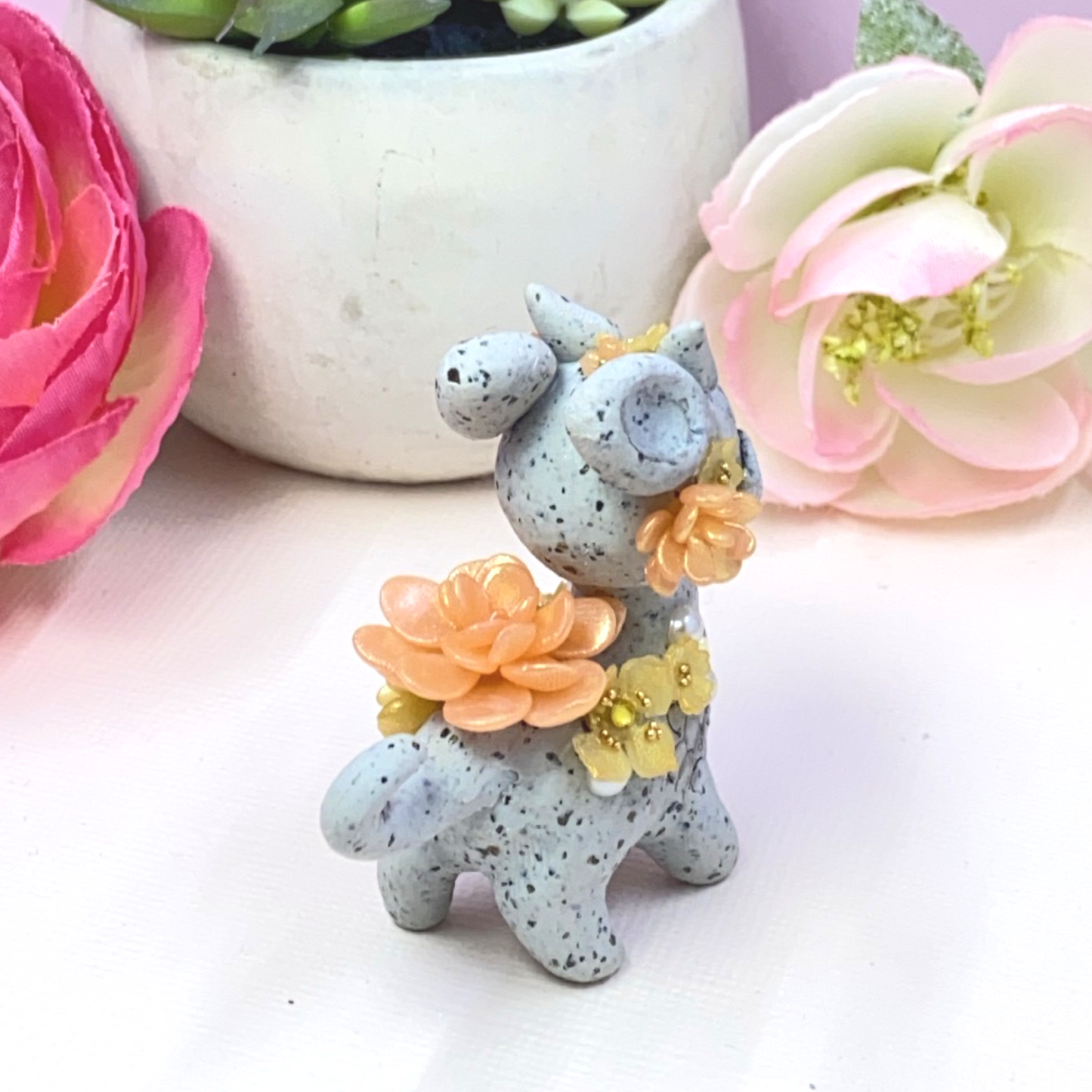 Stone Dragon with Peach and Yellow Succulents