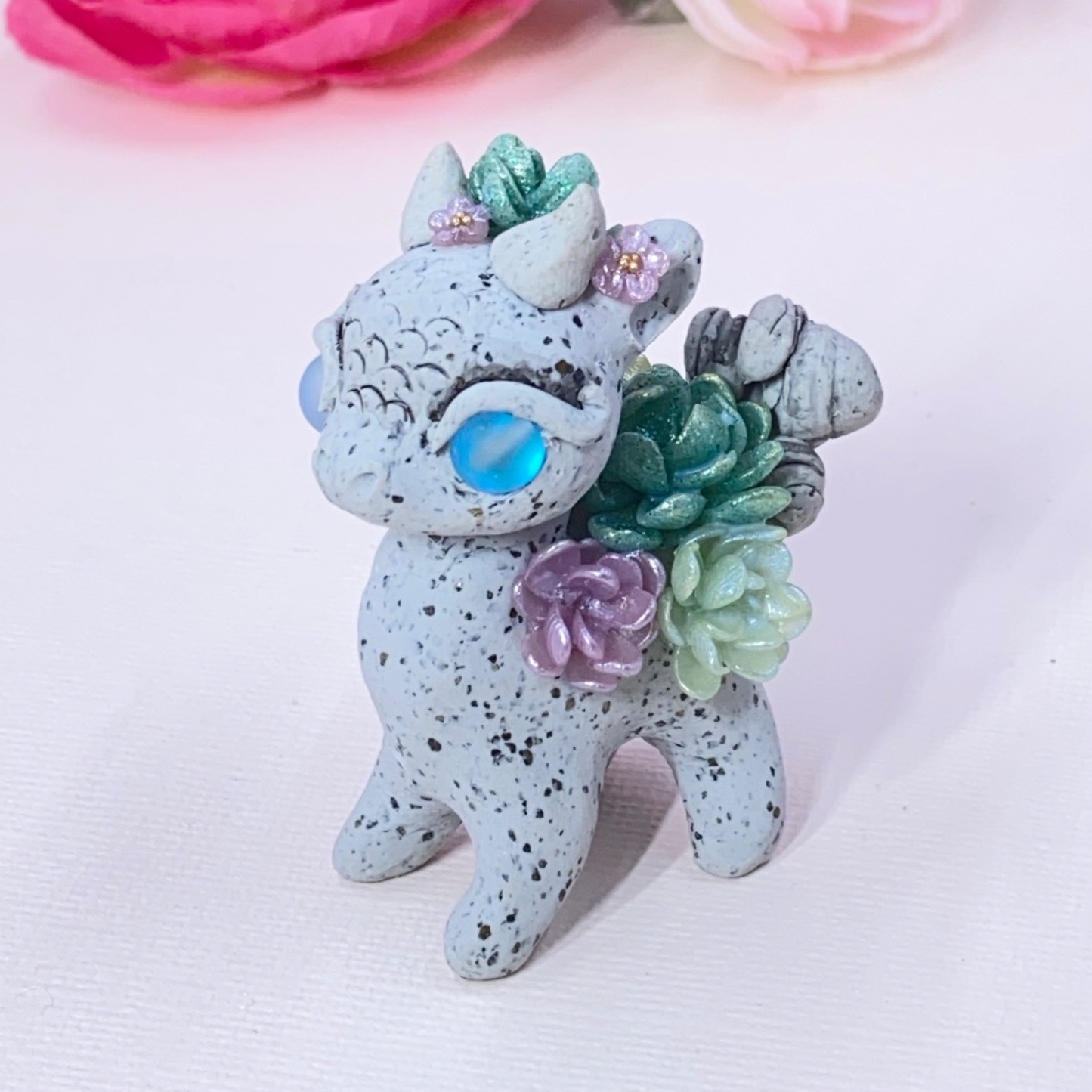 Stone Dragon with Purple and Green Succulents