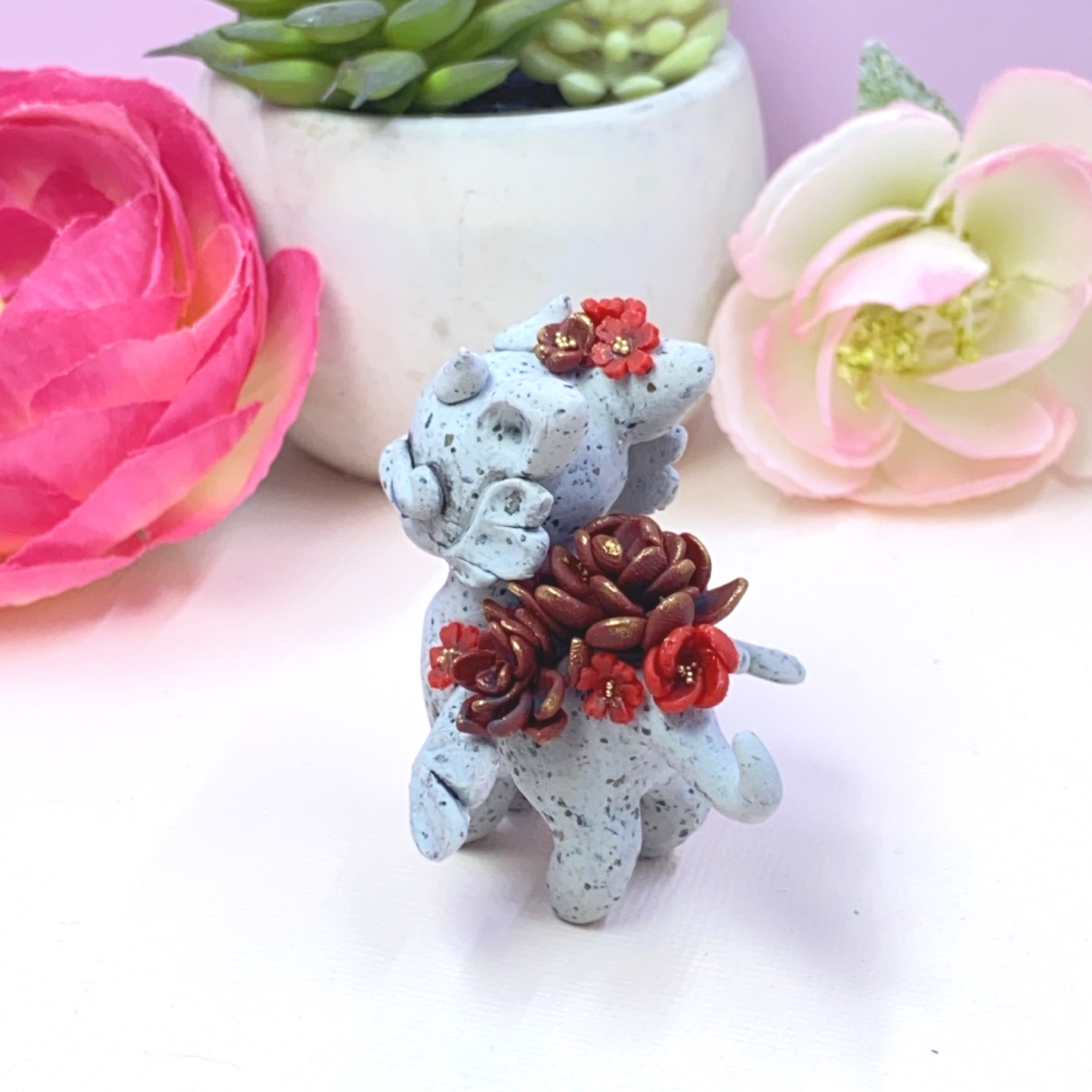 Stone Dragon with Red Succulents