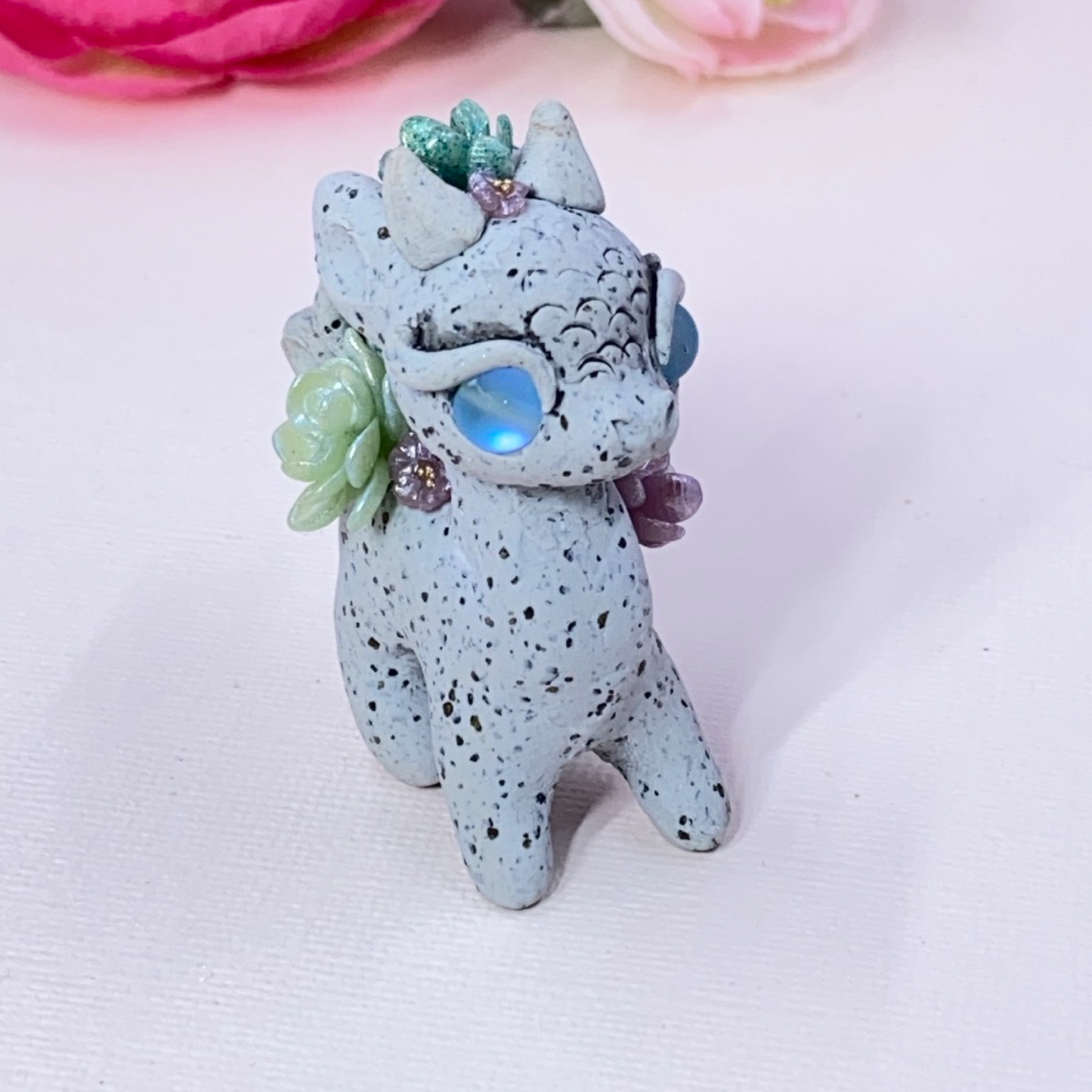 Stone Dragon with Purple and Green Succulents