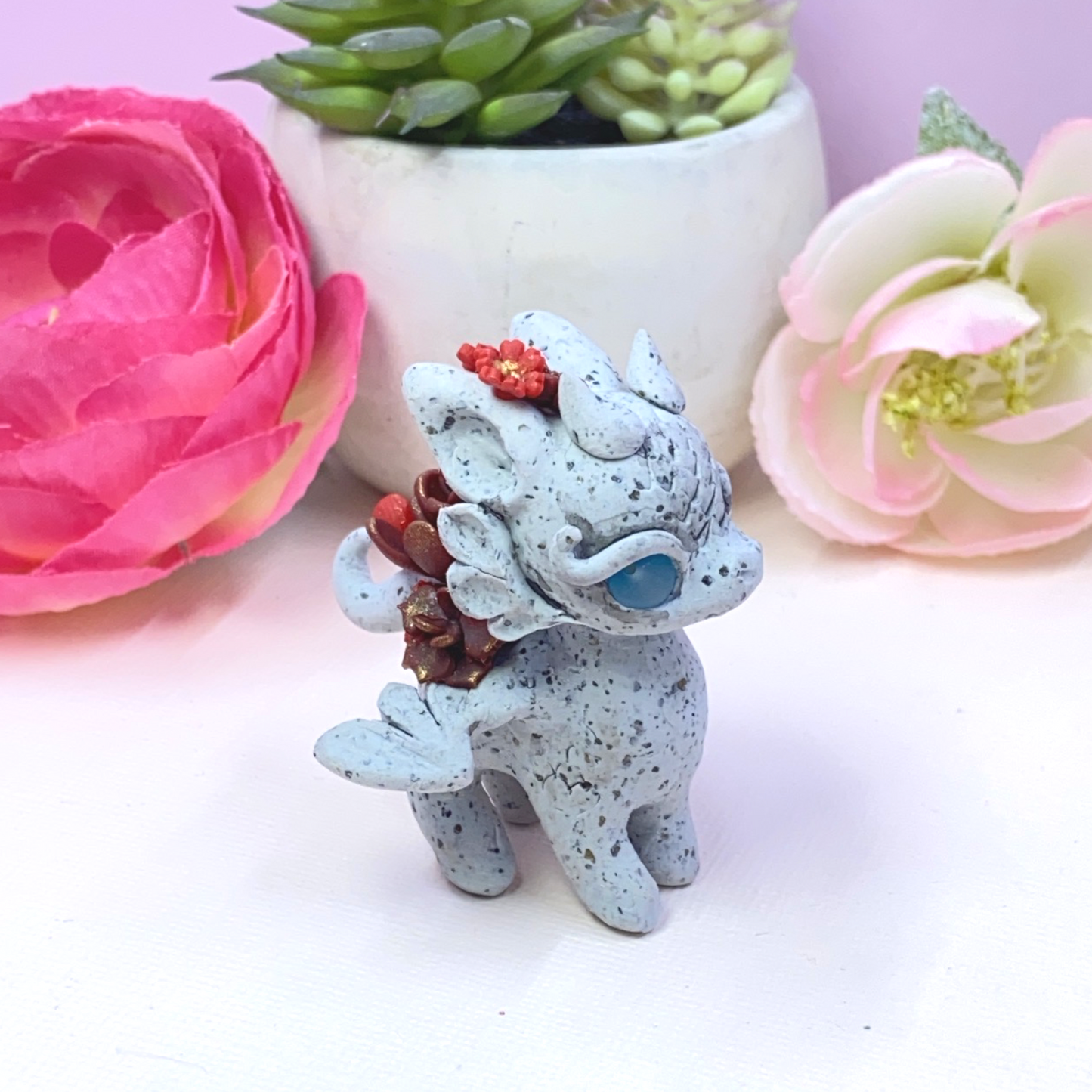 Stone Dragon with Red Succulents