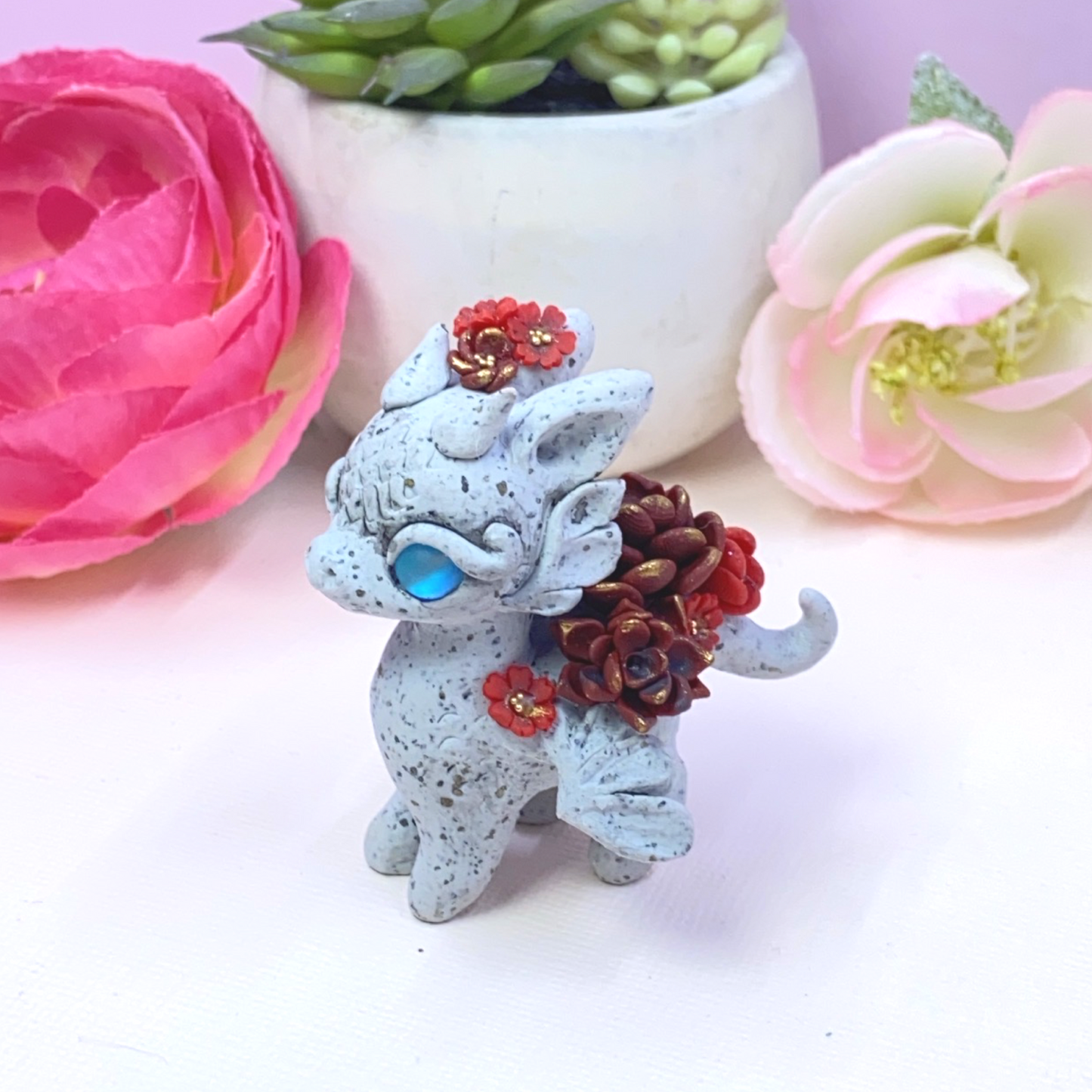 Stone Dragon with Red Succulents