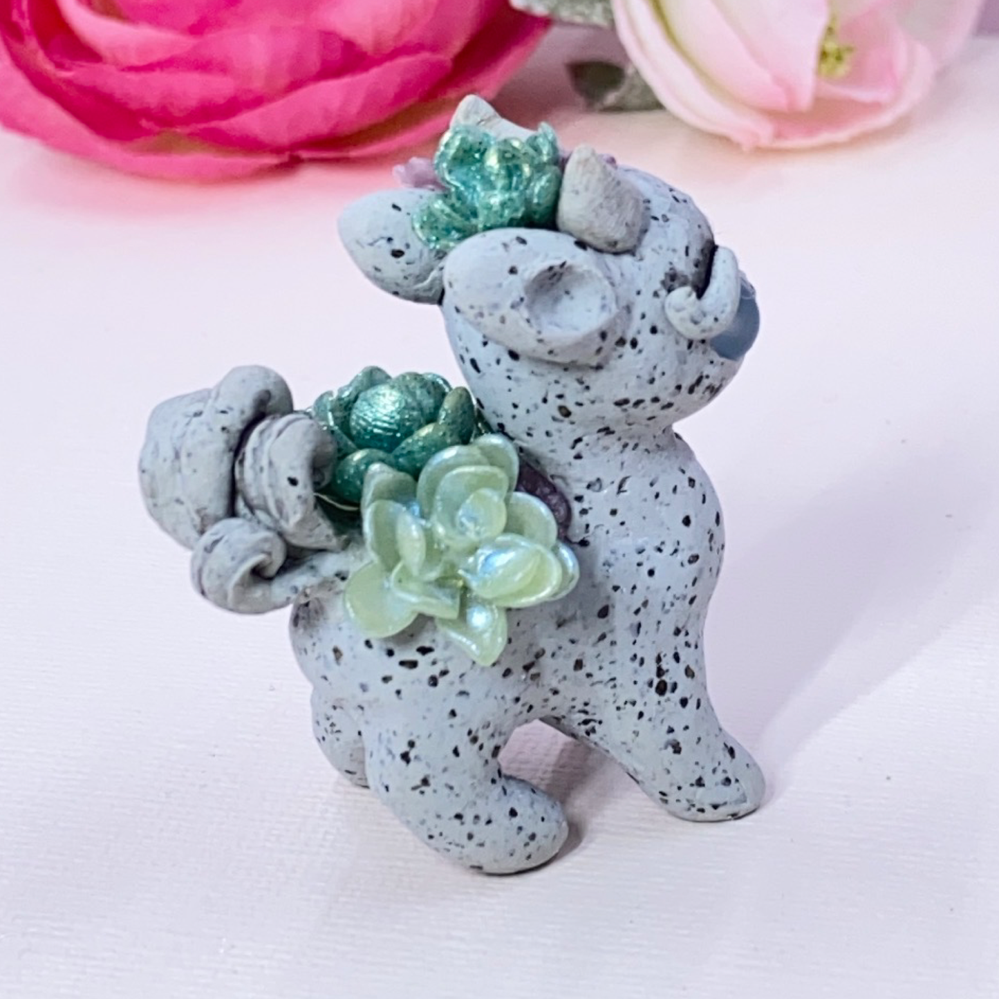 Stone Dragon with Purple and Green Succulents