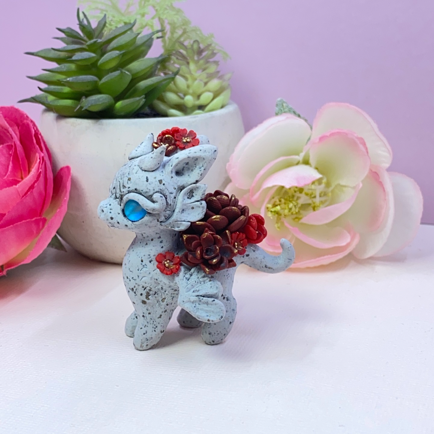 Stone Dragon with Red Succulents