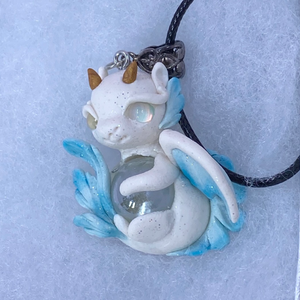 White and blue baby dragon pendant
