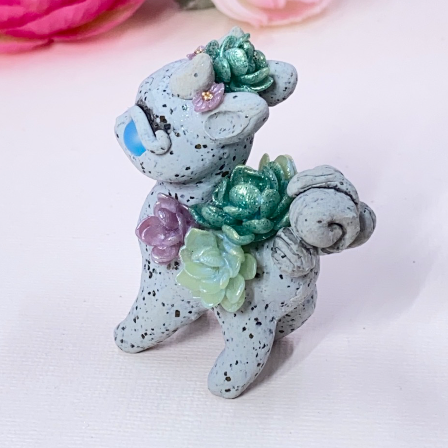 Stone Dragon with Purple and Green Succulents