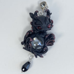 Black and Red Dragon With Crystal