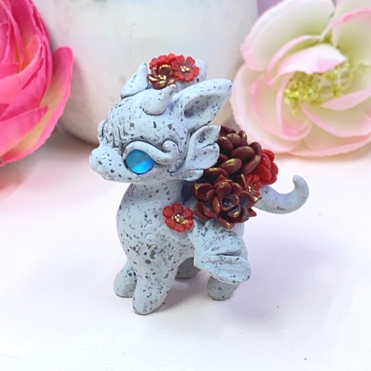 Stone Dragon with Red Succulents
