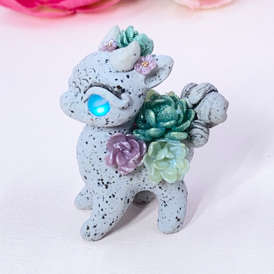 Stone Dragon with Purple and Green Succulents
